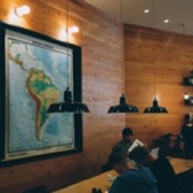 A Room with a Map of South America and Students